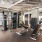 fitness center with large open spaces allowing room for workouts and for using equipment