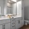 bathroom with multiple shelves for storage and bathroom items