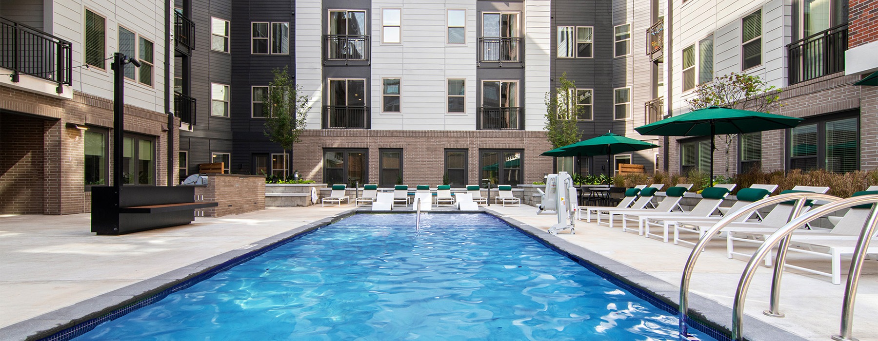 a swimming pool surrounded by sun beds